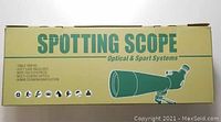 Packaging box labeled “SPOTTING SCOPE Optical & Sport Systems” with illustration and feature list
