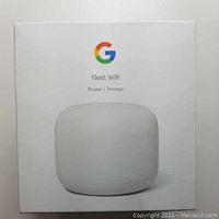 Front of the box showing Google Nest Wifi Router image and branding.