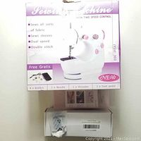 Boxed JYSM-301 sewing machine with features and accessories listed on the packaging.