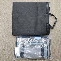 Black folded dog car seat cover with mesh visible and packaged OMORC pet carrier