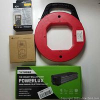 Photo showing all items: red steel fish tape, Fluke 101 multimeter box, Neoteck multimeter box, Vivosun electronic ballast box.