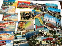 Overview of vintage postcard collection spreading multiple postcards face up showing Florida and Texas scenes.