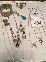 Overview of all jewelry items on fabric background