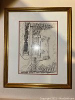 Framed black and white winter scenery hand sketch drawing with architectural elements and trees.