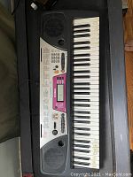 Full keyboard top view showing keys, speakers and control panel