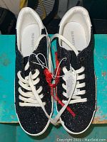 Pair of brand new black glittery girls running shoes by Old Navy, size 8, showing top view with white shoelaces and interior.