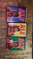 Front covers of three Alf VHS tapes showing colorful artwork and title with the character Alf.