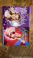 Front covers of Bewitched and I Dream of Jeannie Season 2 DVD sets placed side by side on a wooden floor.