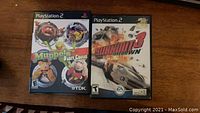 Photo of front covers of Burnout 3 Takedown and The Muppets Party Cruise PlayStation 2 game cases showing cover art and branding