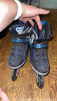 Photo of the inline roller blades showing the front upper part with Airwalk logo and blue and black color scheme.