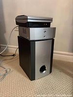 Front and side view of the stacked Pioneer CD tuner on top of the Pioneer subwoofer showing front panels and control elements.