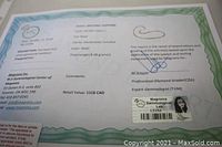 Gemmological certificate of the necklace detailing the natural sapphire composition, weight and retail value