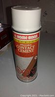 White aerosol spray can with Home-Bond label reading 'Premium Sprayable Contact Cement'.