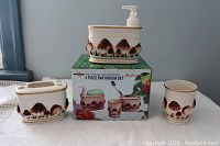 Ceramic 3-piece bathroom set with mushrooms painted, shown with box displaying same design and branding.