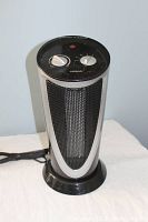 Photo of Noma CTOH1 oscillating heater showing front and top dials