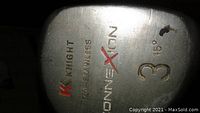 Close-up of the 3-wood clubhead showing Knight brand, 'ConneXtion' name, 17-4 stainless steel material marking, and 15 degrees logo (minor paint damage visible).