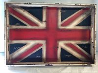 Top view of the rectangular wooden tray painted with the Union Jack design showing the distressed, antique finish.