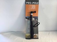 Full view of GOcase PRO-POLE selfie stick monopod in packaging showing branding and product features.