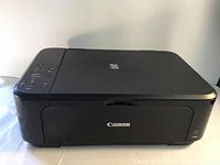 Front view of the Canon PIXMA MG3620 printer showing compact rectangular design and Canon logo on front panel.