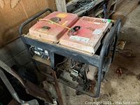 Left side view showing red housing, steel frame and wheels