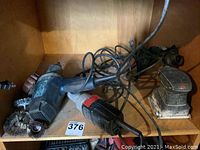 Photo of three power tools including Mastercraft impact wrench, Sears Craftsman grinder and Jobmate sander on wooden shelving.