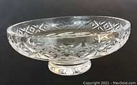 Clear crystal Tyrone bowl, side view showing cut diamond and star patterns with rounded footed base.