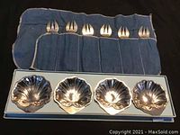Six vintage oyster forks in blue fabric pouch with four oyster shell shaped bowls in box