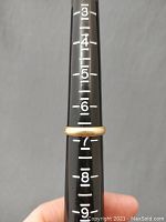 Ring on mandrel showing size measurement at 7