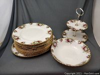 Full lot: stack of dinner plates, serving bowl and two-tier stand