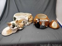 Both cookie jars shown with lids removed to display designs and size comparison