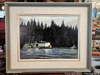 Frontal view of framed oil painting showing seascape scene with boats and forest background