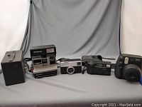 All five cameras lined up showing size and style variety