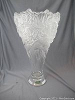 Full view of large frosted and clear crystal vase with rose designs, showing silhouette and structure
