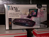 Front of the box showing the device and branding, highlighting PC to TV video conversion for presentations, gaming, training, and internet viewing.