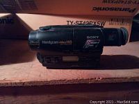 Side view of vintage Sony Handycam Hi-8 video camcorder showing model name and 24x zoom marking