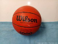 Front view of the Wilson Pro 1000 basketball showing logo and condition.