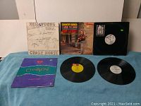 First image showing Neil Young & Crazy Horse, Eddy Arnold, Bill Cosby, and Charvoni albums with vinyl records displayed.