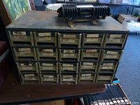 Metal small parts chest with labeled drawers, surface rust, oxidation, and wear