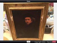 Full front view of framed print on countertop, showing overall condition and frame wear