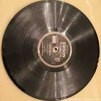 Top view of one thick black Edison Recreation record showing the label in the center titled 'Liebestraum' by Percy Chapman.