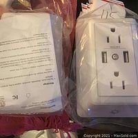 Clear images of new Powrui wall charger surge protector showing front with two AC outlets and two USB ports, and the rear side showing the instruction sheet, all sealed in plastic packaging.
