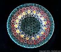 Top-down view of the front of the miniature Millefiori glass plate showing the colorful intricate concentric circular patterns.