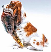 Side view of the Royal Doulton dog figurine showing detailed painting and the bird in the mouth