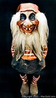 Front view of the extra large vintage hand painted troll doll showing facial features and front clothing details