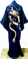 Back view of navy kimono showing full gold embroidered dragon motif