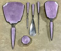 All six pieces laid out flat on neutral background