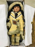 Full view of the doll in original box showing overall condition and packaging