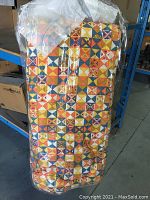 Vintage Sleepeze III sleeping bag showing colorful geometric pattern on nylon exterior cover, packed in plastic