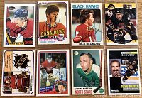 Top view of all 8 autographed hockey cards showing player images, team names, and signatures on front.