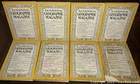 Eight visible National Geographic magazine covers in yellow border showing list of published articles and issue details, titles dated from 1938 to 1970s.